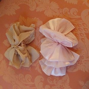 NWOT. Two large bows. One pink and one beige.